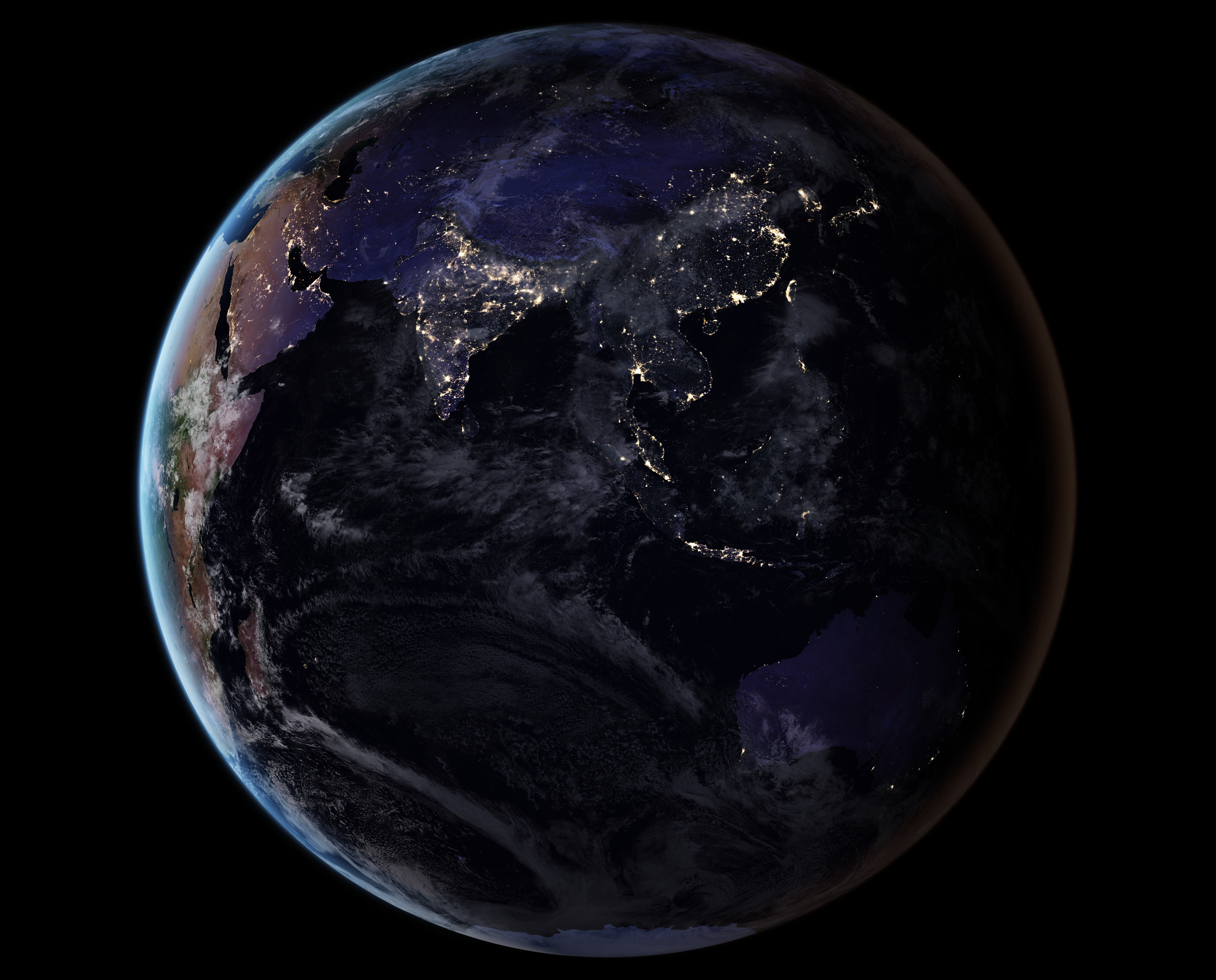 从太空俯瞰亚洲夜景，城市灯光与蓝色大气层边缘清晰可见